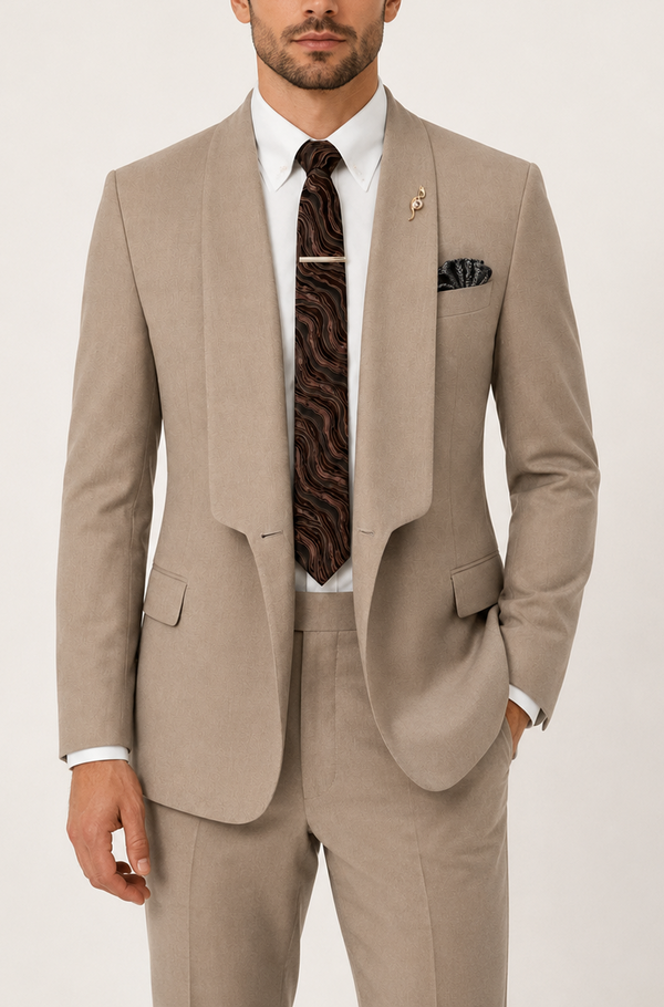 Man wearing a beige suit with a patterned tie on a white background