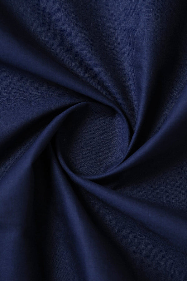 Close-up of dark blue fabric with a swirl pattern