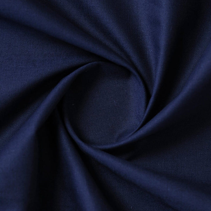 Close-up of dark blue fabric with a swirl pattern