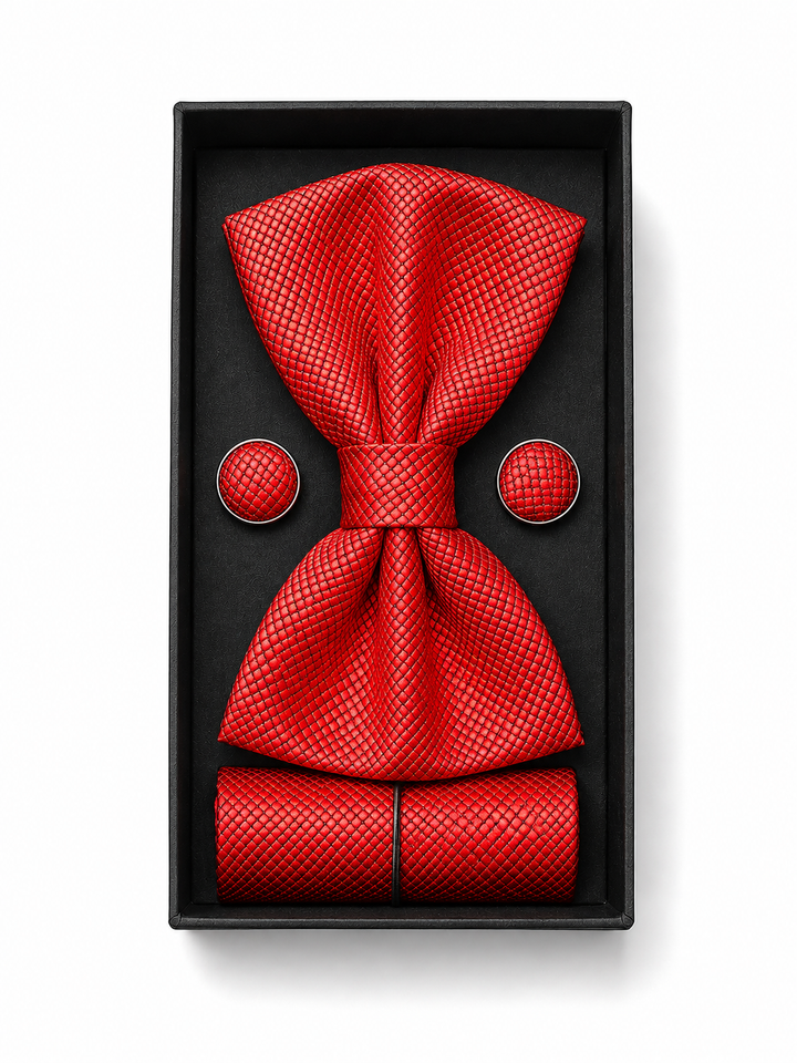 A red textured men's accessory set including a bow tie, matching pocket square, and round cufflinks, presented in a black gift box on a white background.